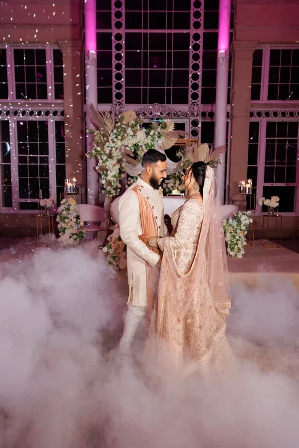 A couple celebrating together under evening lights